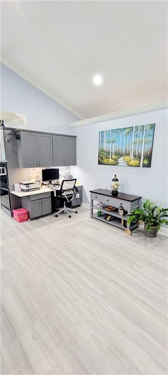 living room with built in desk and light hardwood / wood-style flooring