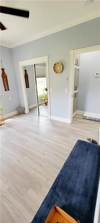 interior space with light hardwood / wood-style floors and ceiling fan