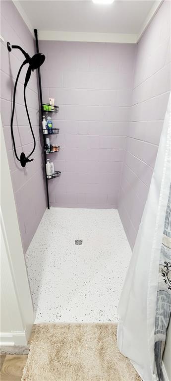 bathroom with a shower with curtain