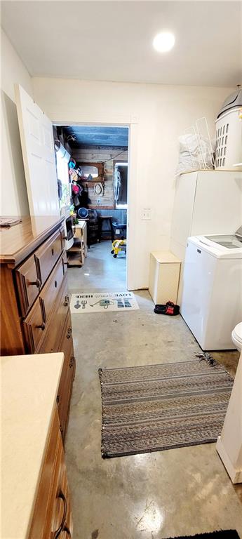 clothes washing area with washer / dryer