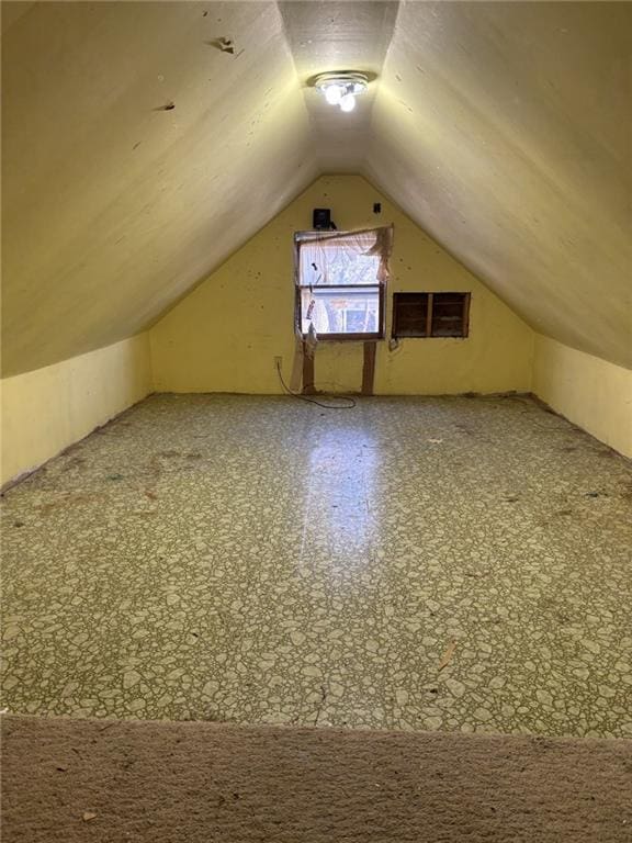 bonus room featuring lofted ceiling