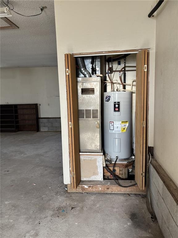 utility room with electric water heater