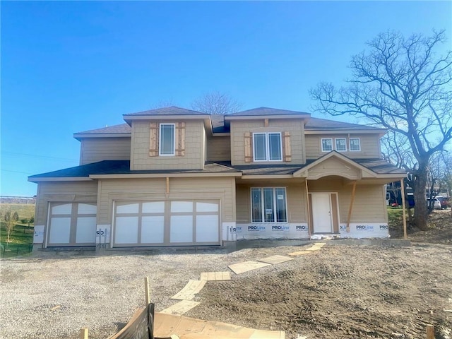 view of front of property with a garage