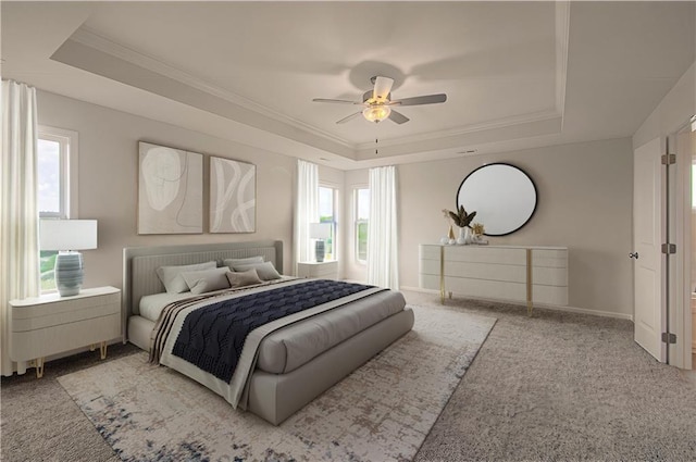 bedroom featuring a tray ceiling, ceiling fan, and carpet flooring