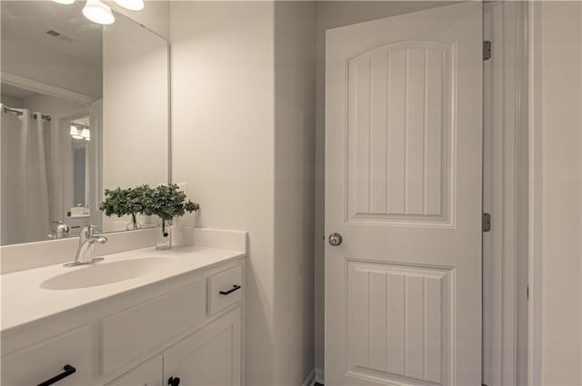 bathroom featuring visible vents and vanity