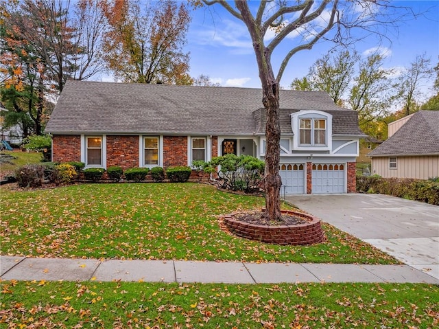 view of front facade with a front yard and a garage