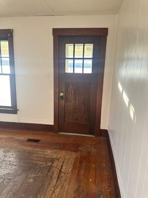 doorway to outside featuring dark hardwood / wood-style floors and a wealth of natural light