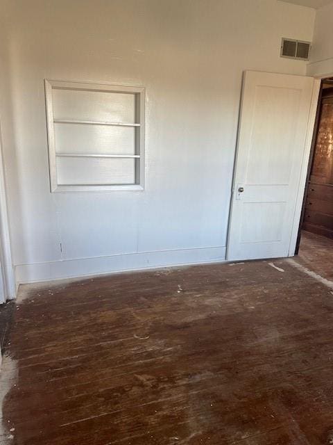 empty room with dark hardwood / wood-style floors