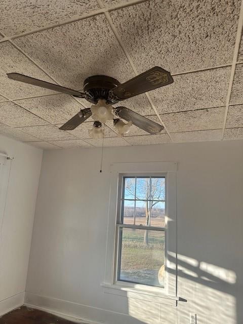 details with a paneled ceiling and ceiling fan