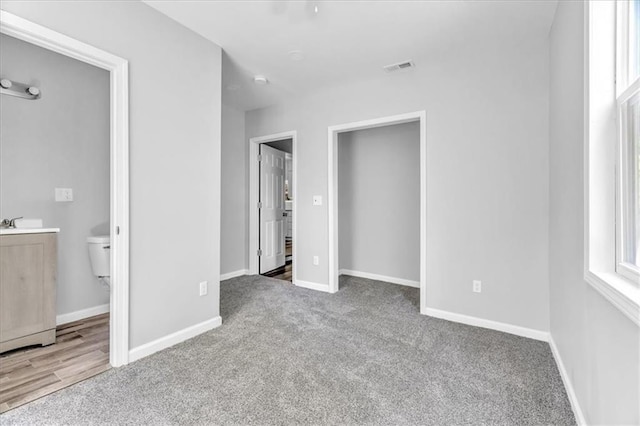 9043 Walnut St, Kansas City, MO 64114 - unfurnished bedroom featuring carpet, baseboards, and ensuite bathroom