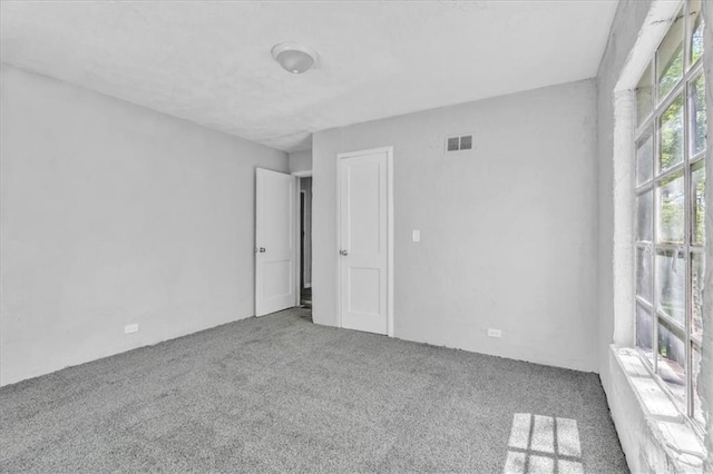9043 Walnut St, Kansas City, MO 64114 - spare room featuring carpet flooring