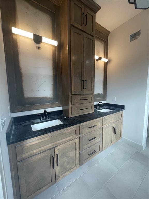 bathroom with tile patterned flooring and vanity