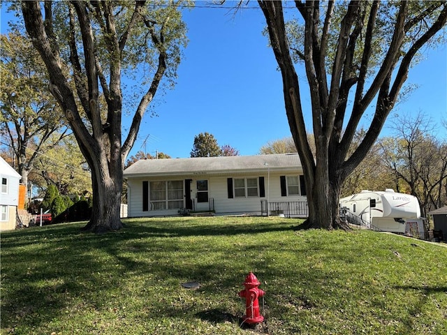 single story home featuring a front yard