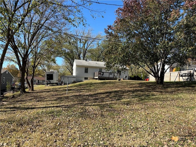 view of yard with a wooden deck