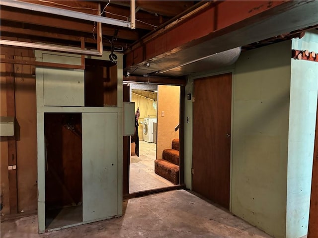 basement with washer and clothes dryer