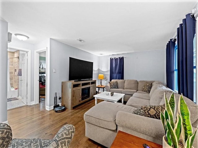 9317 Gillette St, Lenexa, KS 66215 - living room with wood finished floors and a fireplace