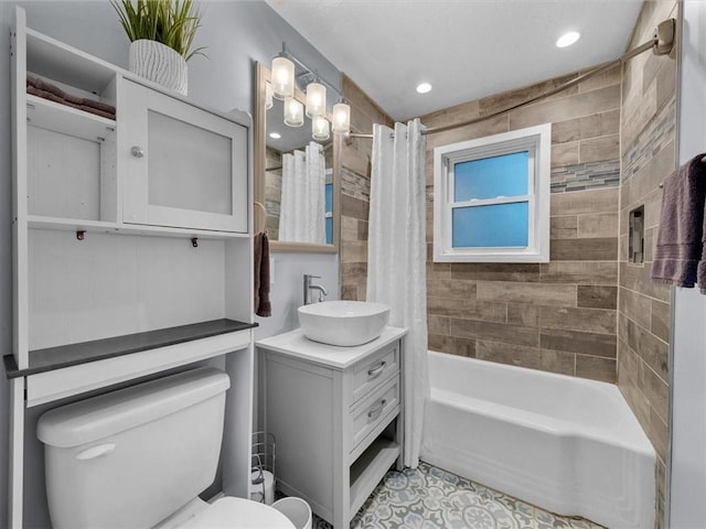 9317 Gillette St, Lenexa, KS 66215 - bathroom with vanity, shower / tub combo, tile patterned flooring, and recessed lighting
