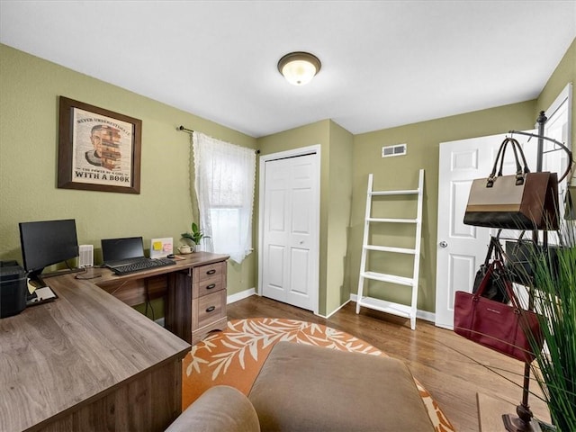 9317 Gillette St, Lenexa, KS 66215 - home office featuring wood finished floors and baseboards