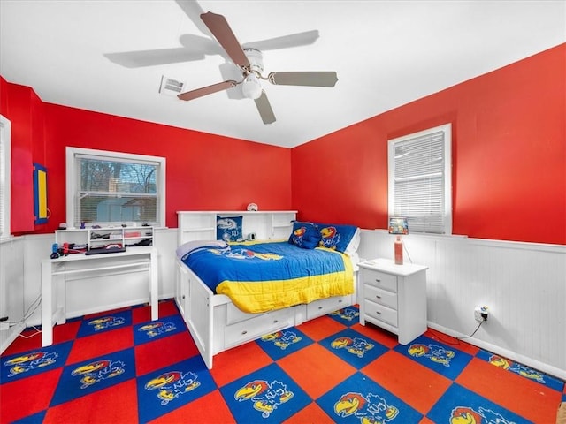 9317 Gillette St, Lenexa, KS 66215 - bedroom featuring wainscoting and a ceiling fan