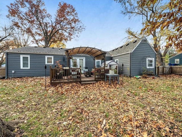 9317 Gillette St, Lenexa, KS 66215 - back of property featuring a deck, a pergola, and a shingled roof