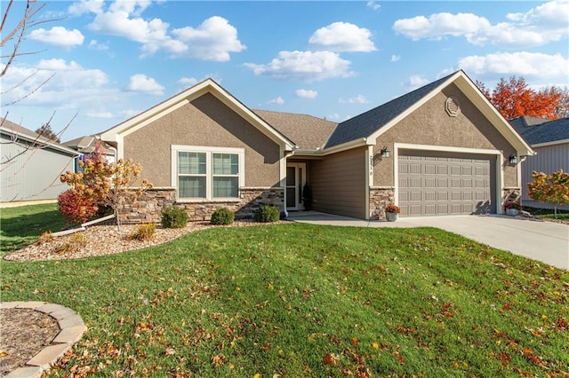 view of front of home with a front yard and a garage