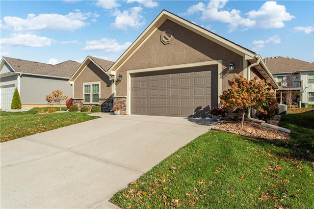 view of front of house with a front yard and a garage