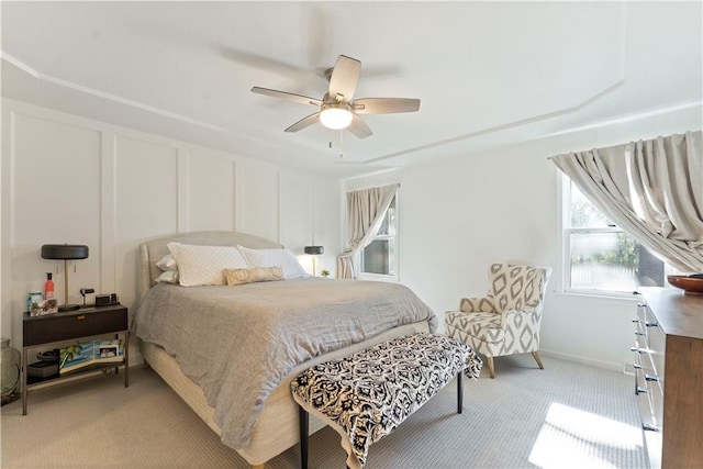 bedroom featuring ceiling fan and light carpet