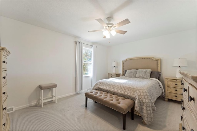 bedroom featuring ceiling fan and light colored carpet