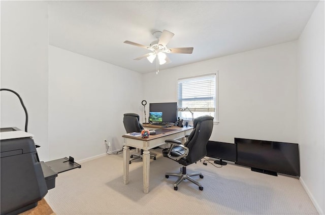 home office featuring ceiling fan and light carpet