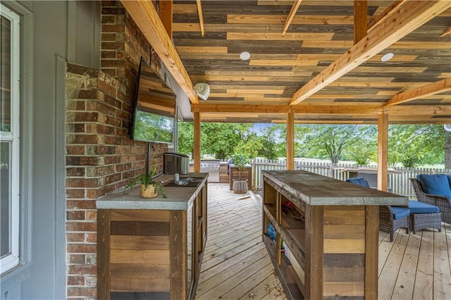 wooden terrace with a bar