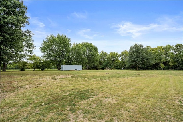 view of yard with a rural view