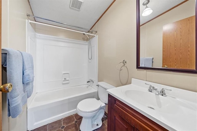 full bathroom featuring washtub / shower combination, tile patterned floors, a textured ceiling, toilet, and vanity