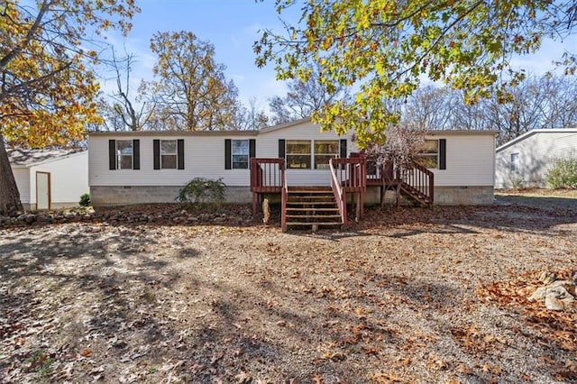 view of front of house with a deck