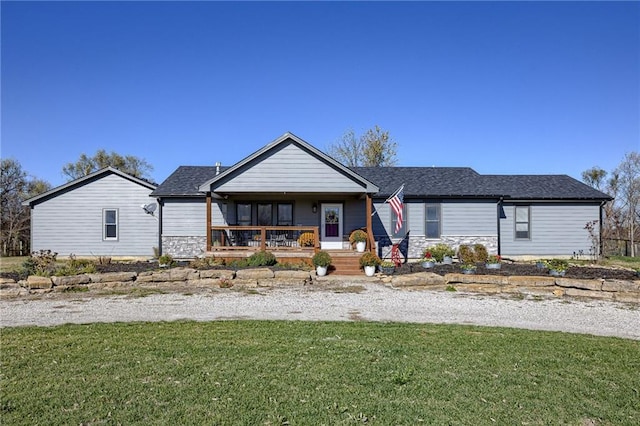 view of front of property with a porch and a front lawn