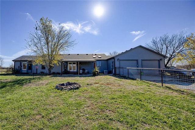 ranch-style house featuring a garage and a front yard