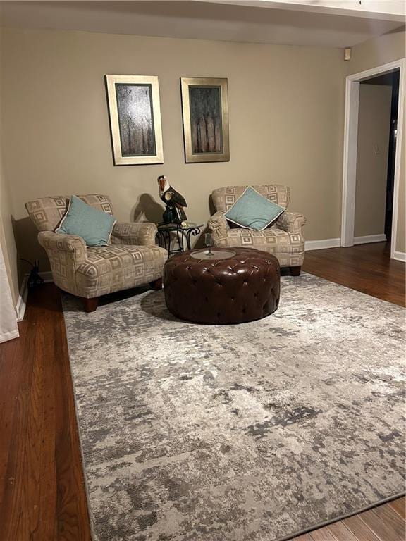 sitting room with dark hardwood / wood-style floors