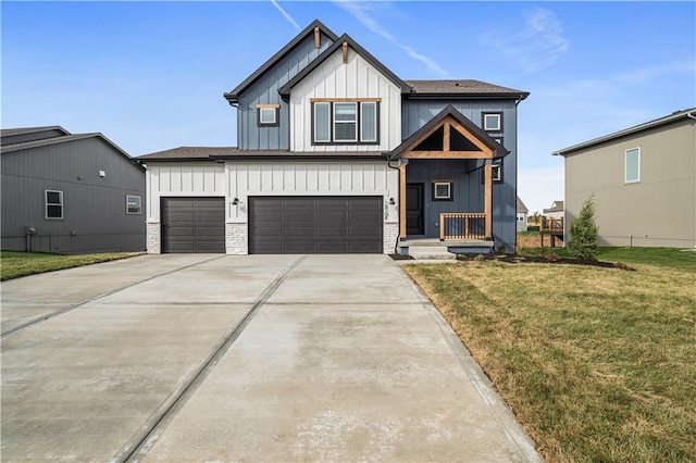 view of front of property with a garage and a front yard