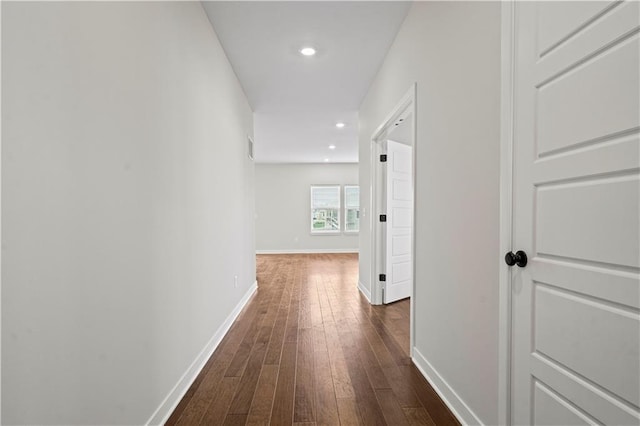 hallway with dark wood-type flooring