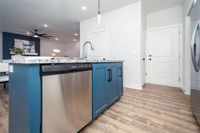 kitchen with pendant lighting, blue cabinets, dishwasher, a center island with sink, and light wood-type flooring