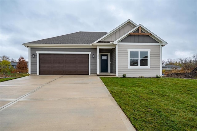 view of front of home featuring a garage and a front lawn