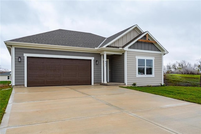 view of front facade with a garage and a front lawn