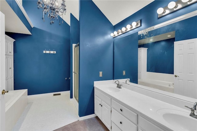 bathroom featuring plus walk in shower, vanity, vaulted ceiling, and an inviting chandelier