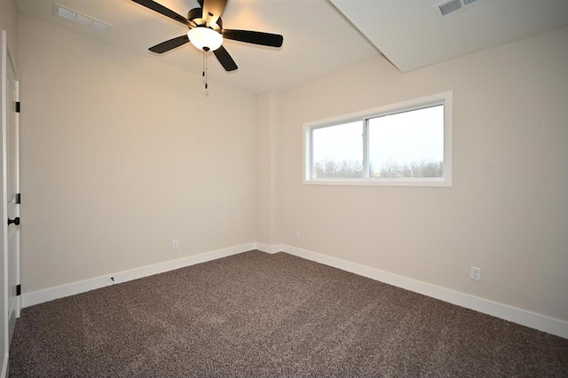 carpeted spare room featuring ceiling fan