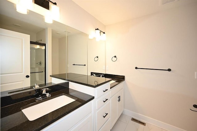 bathroom with vanity and walk in shower