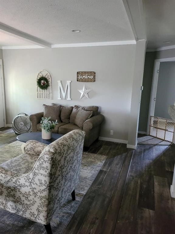 living room featuring a textured ceiling, dark hardwood / wood-style flooring, and crown molding