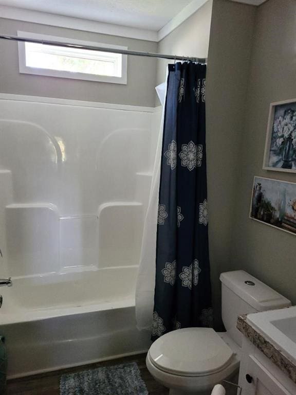 full bathroom featuring shower / bath combo with shower curtain, vanity, and toilet