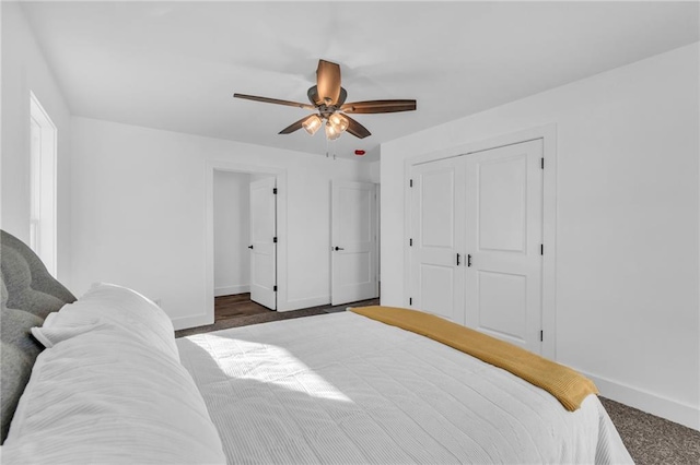 bedroom with ceiling fan and a closet