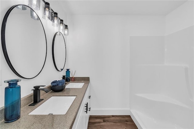 bathroom featuring hardwood / wood-style flooring and vanity