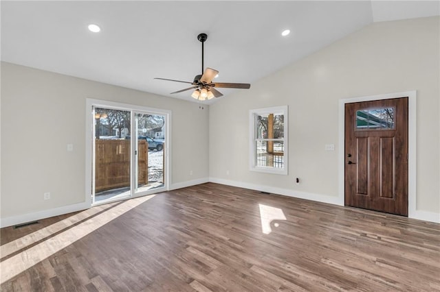 unfurnished living room with lofted ceiling, hardwood / wood-style floors, and ceiling fan