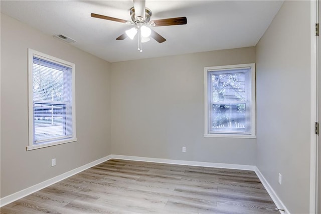 empty room featuring ceiling fan and light hardwood / wood-style floors